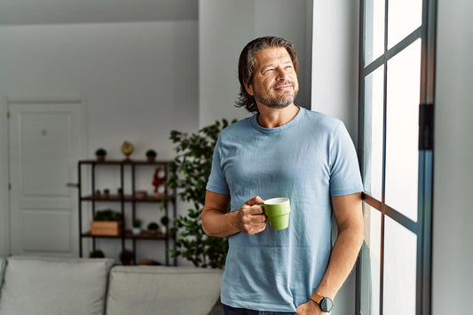 Sober man looking out of the window